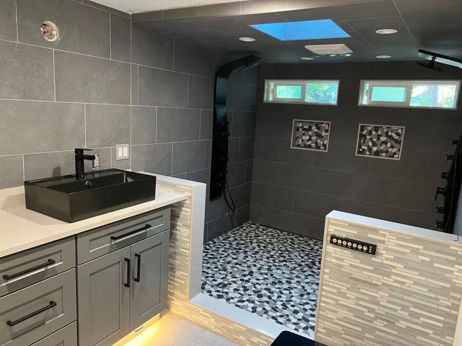 Glass enclosed shower with subway tile and black fixtures Kirkland