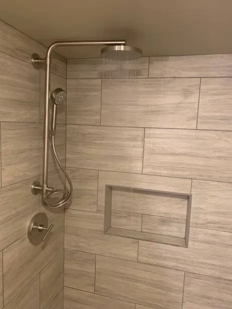 Marble tile bathroom with glass shower and white vanity Seattle