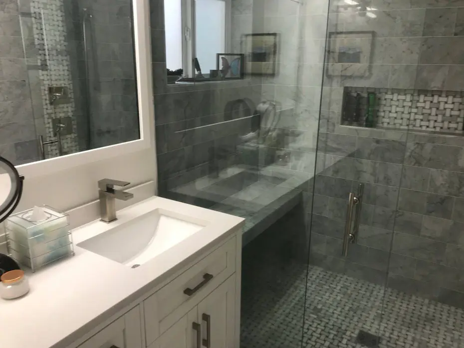 Double vanity bathroom remodel with quartz top and crystal lighting