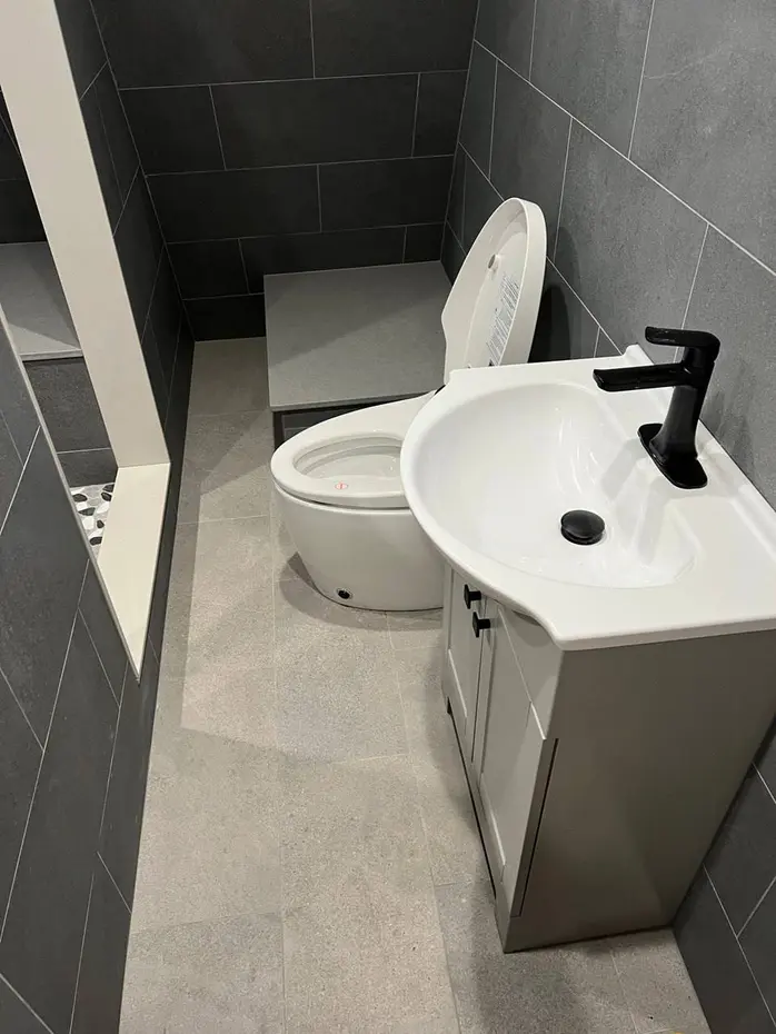 Custom tile shower with glass door and hexagon floor Redmond WA