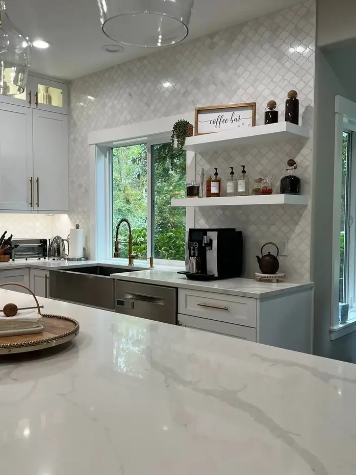 Quartz countertop with arabesque tile backsplash and coffee bar