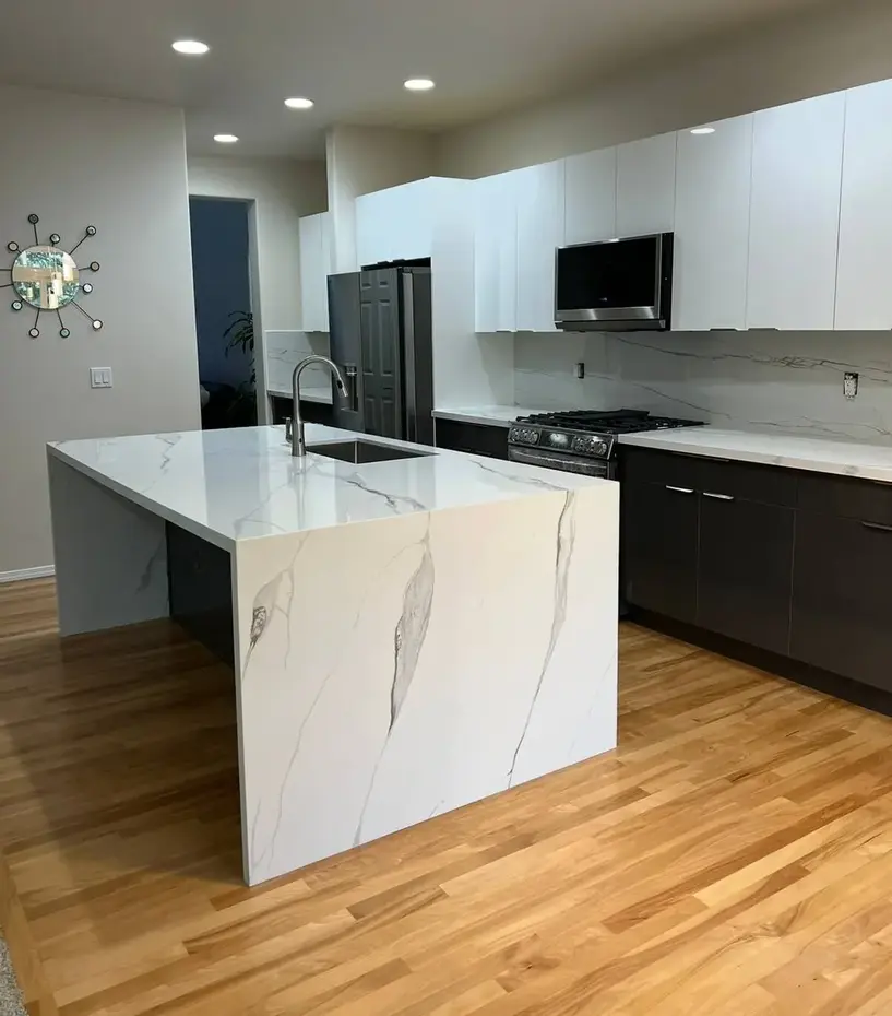 Gray marble countertop island with fireplace accent wall kitchen renovation