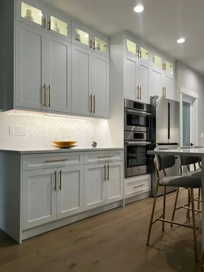 White Shaker kitchen cabinets with gold hardware installed in Bellevue WA